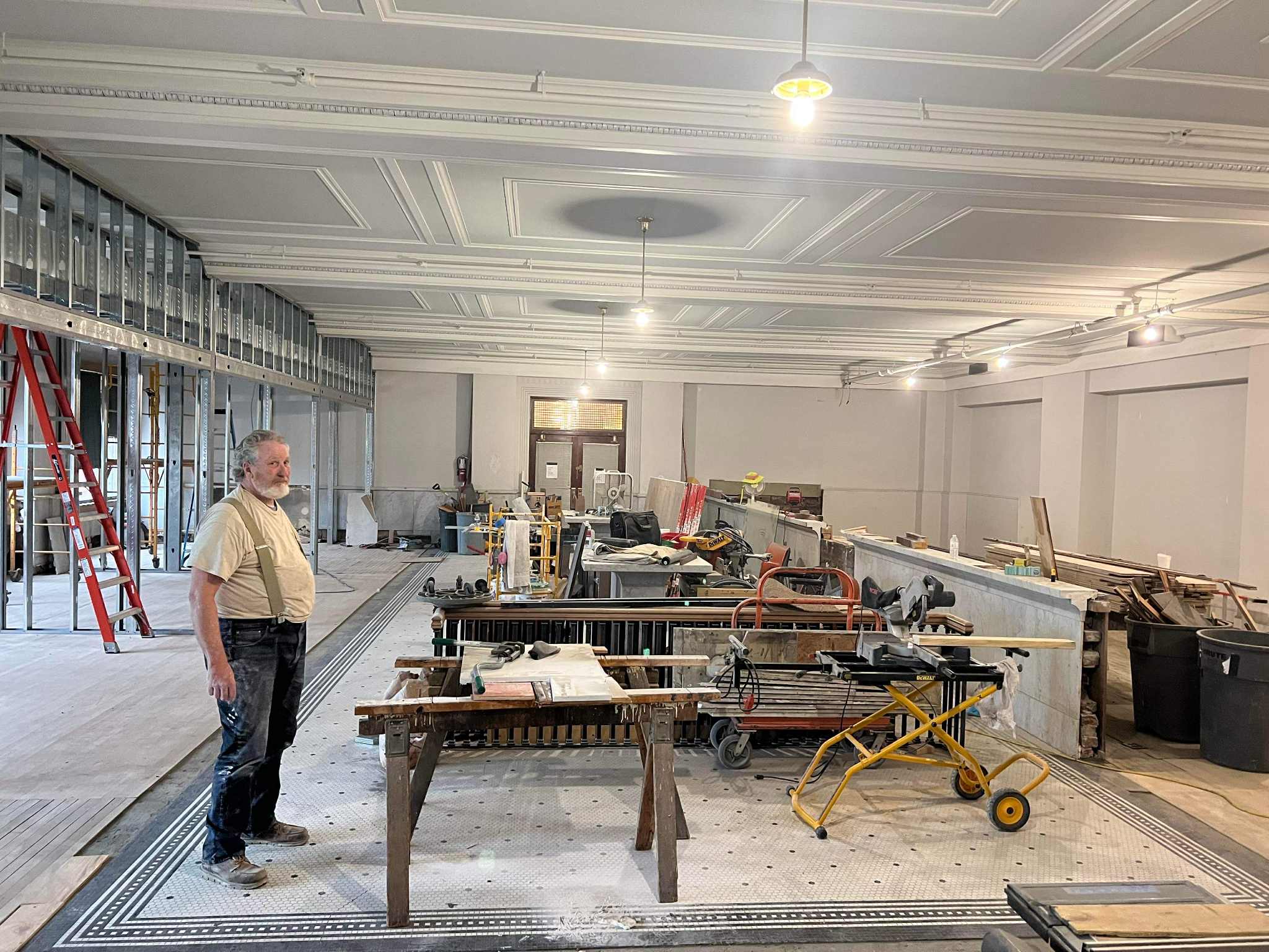 Historic stone repair at landmark hotel showing preservation of original details