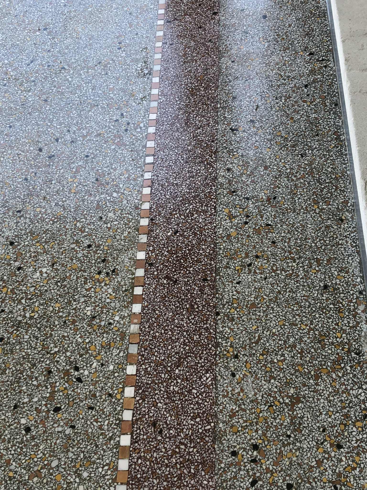 Terrazzo restoration and polishing showing diamond-polished aggregate finish at Fort Leavenworth