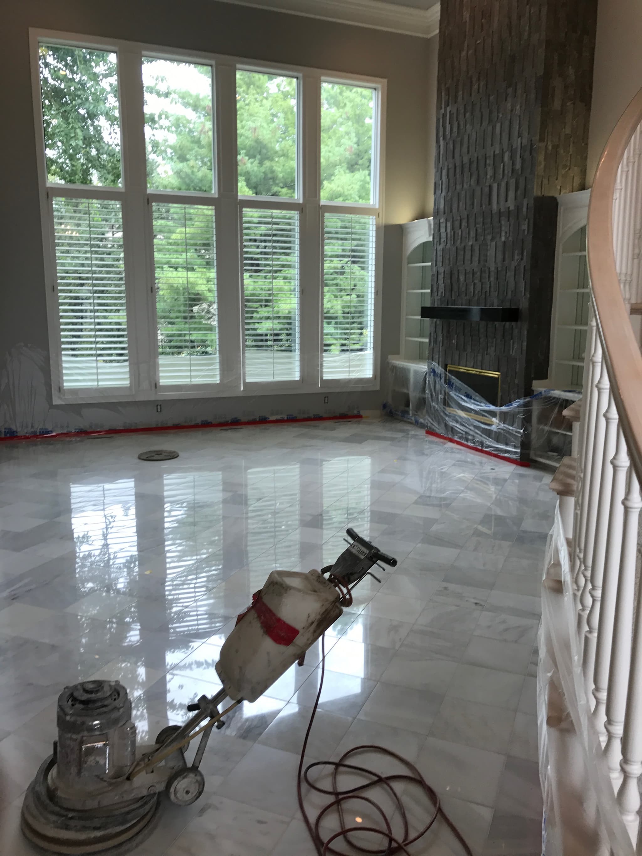 Travertine polishing showing restored and sealed surface in luxury home