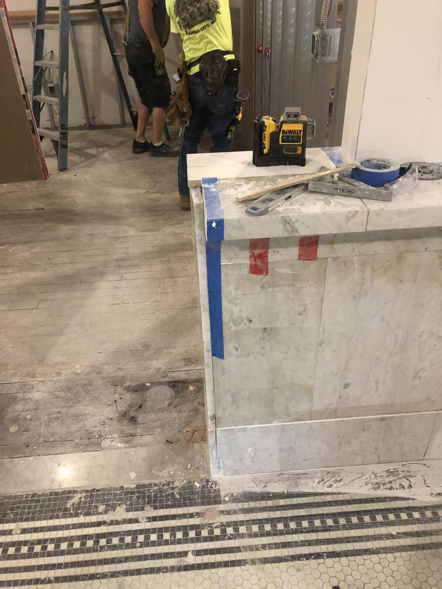 Marble panel and mosaic tile installation