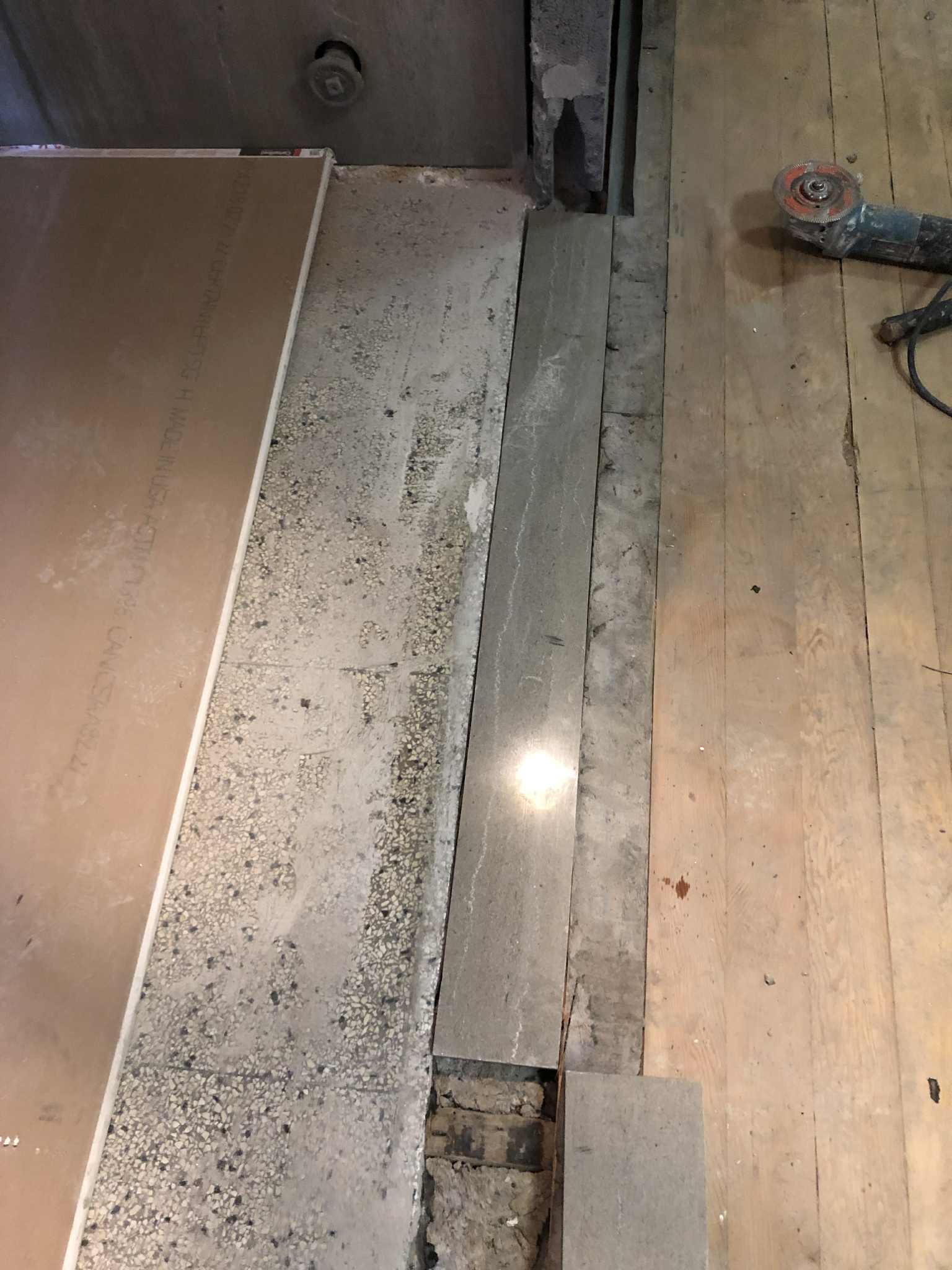 Terrazzo with metal divider strip repair